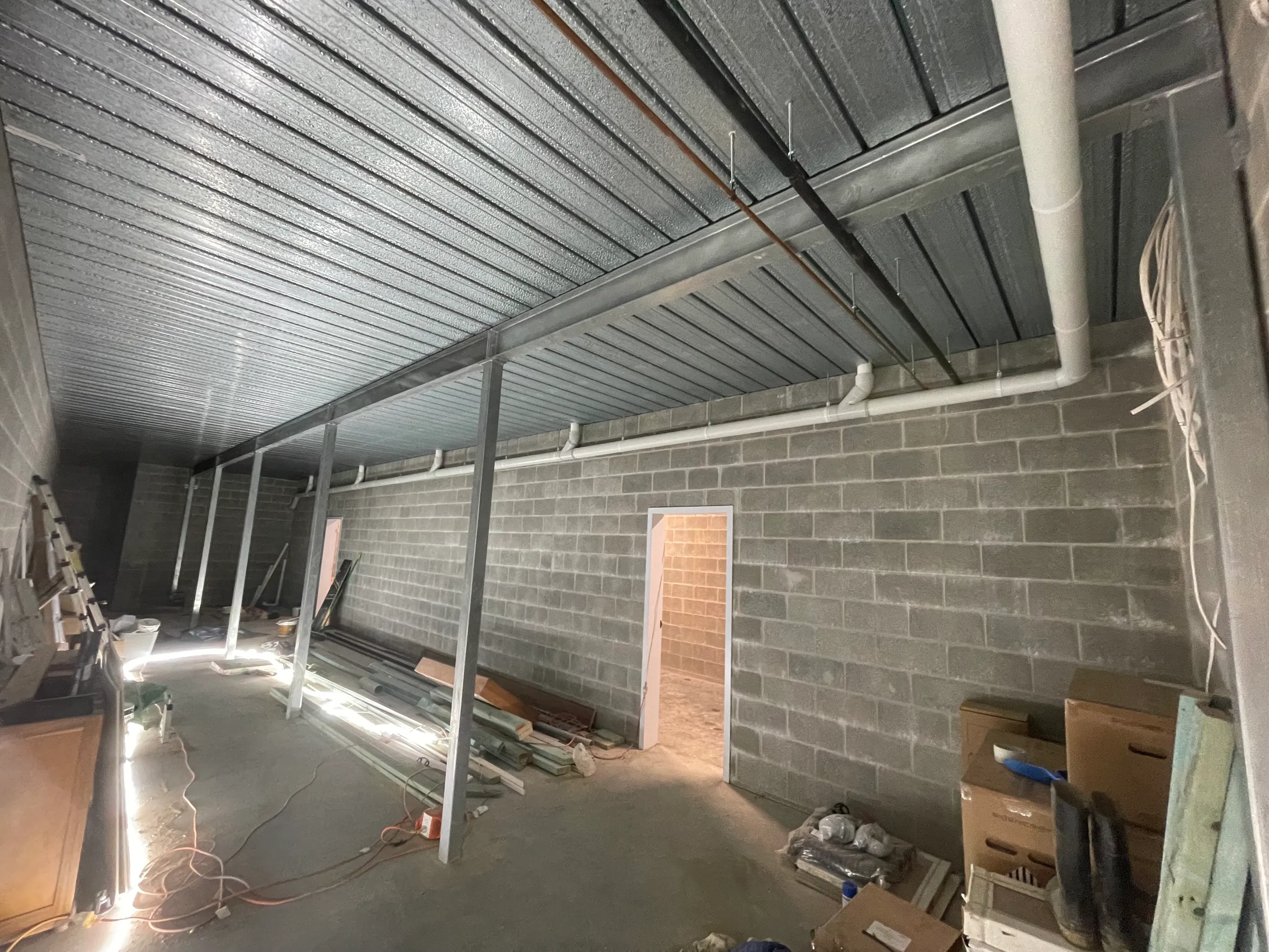 PVC and copper pipework in concrete block commercial interior under construction